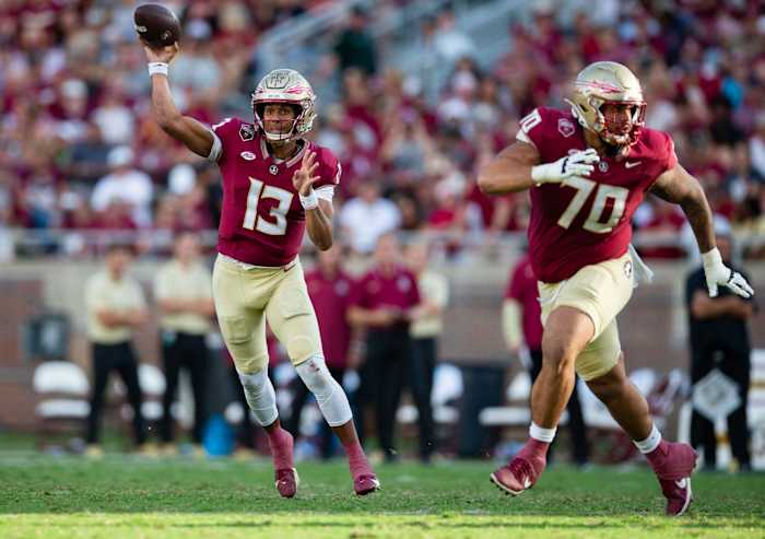 Florida State Seminoles quarterback Jordan Travis (13) passes to his teammate. The Florida State Seminoles defeated the Virginia Tech Hokies 39-17 at Doak Campbell Stadium on Saturday, Oct. 7, 2023.