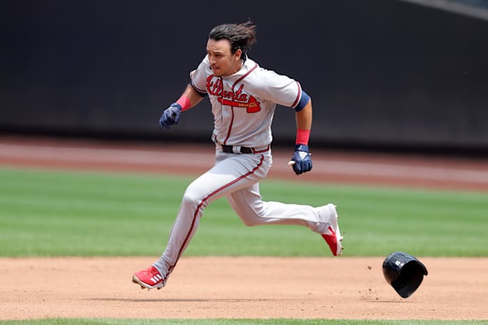 Aug 12, 2023; New York City, New York, USA; Atlanta Braves shortstop Nicky Lopez (15) loses his helmet as he runs to second after hitting an RBI double against the New York Mets during the second inning at Citi Field.