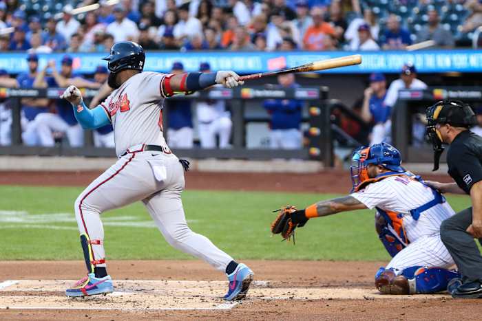 Aug 13, 2023; New York City, New York, USA; Atlanta Braves designated hitter Marcell Ozuna (20) hits a three run double in the first inning against the New York Mets at Citi Field.