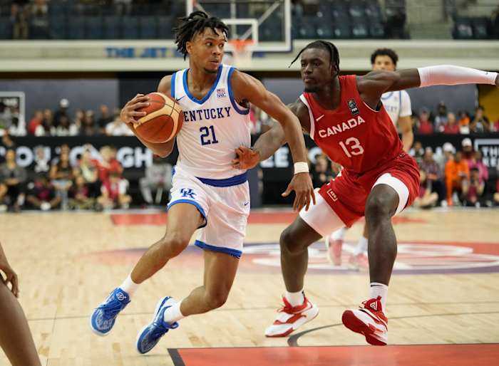 Jul 16, 2023; Toronto, Ontario, Canada; USA-Kentucky guard DJ Wagner (21) drives to the net against Canada center Enoch Boakye (13) during the first half of the Men's Gold game at Mattamy Athletic Centre. Mandatory Credit: John E. Sokolowski-USA TODAY Sports  