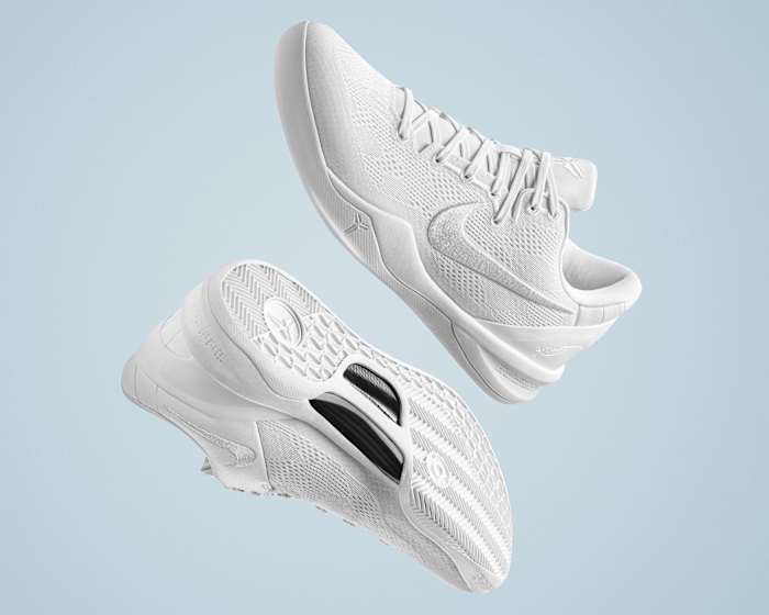 Side view of Kobe Bryant's white Nike basketball shoes.