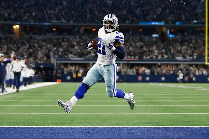 Dallas Cowboys running back Ezekiel Elliott scores a touchdown.