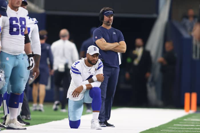 Dallas Cowboys quarterback Dak Prescott looks on from the sidelines during a preseason game.