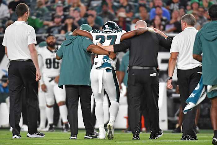 Zech McPhearson is helped off after suffering a torn Achilles.