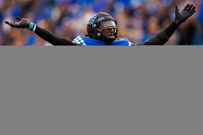 Nov 26, 2022; Lexington, Kentucky, USA; Kentucky Wildcats linebacker J.J. Weaver (13) celebrates during the first quarter against the Louisville Cardinals at Kroger Field. Mandatory Credit: Jordan Prather-USA TODAY Sports
