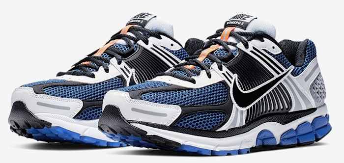 Side view of black, blue, and white Nike running shoes.