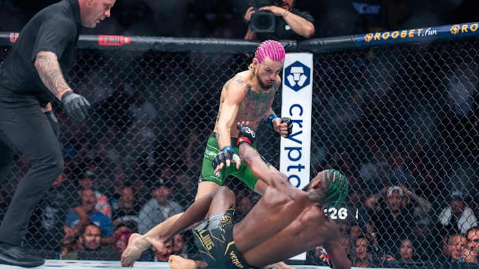 Sean O'Malley knocks down Aljamain Sterling at UFC 292.