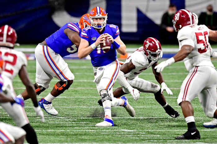 Dec 19, 2020; Atlanta, Georgia, USA; Florida Gators quarterback Kyle Trask (11) runs the ball during the second quarter against the Alabama Crimson Tide in the SEC Championship at Mercedes-Benz Stadium. Mandatory Credit: Adam Hagy-USA TODAY Sports