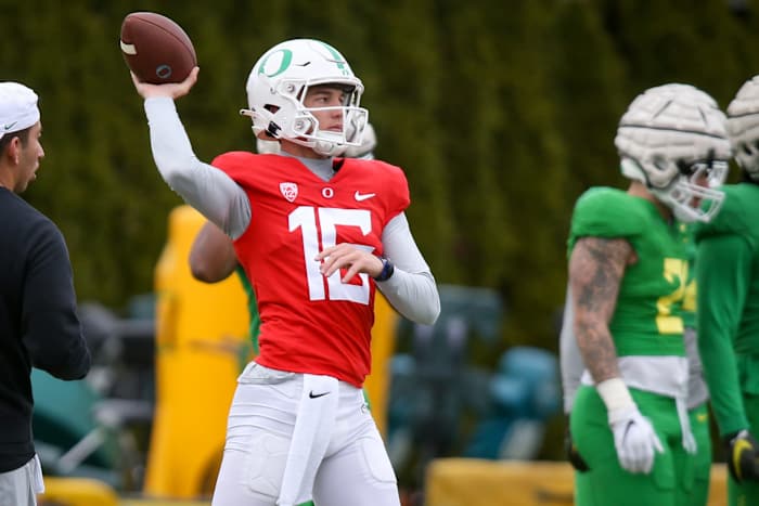 Oregon Ducks true freshman quarterback Austin Novosad throws a pass in fall camp.