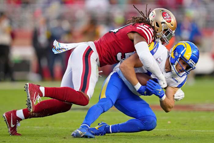 49ers linebacker Fred Warner (54) tackles Los Angeles Rams wide receiver Cooper Kupp