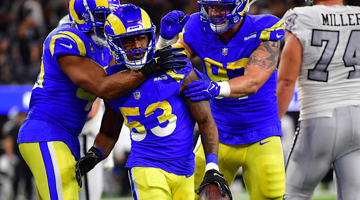 Rams linebacker Ernest Jones celebrates with teammates after an interception.