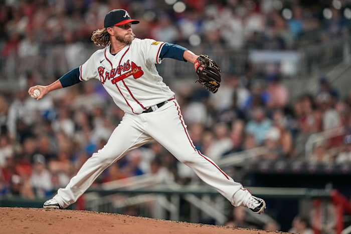 Aug 22, 2023; Cumberland, Georgia, USA; Atlanta Braves relief pitcher Pierce Johnson (38) pitches against the New York Mets during the sixth inning at Truist Park.