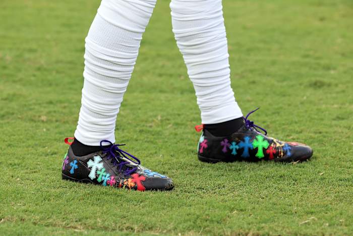 Side view of Odell Beckham Jr.'s black, blue, and green cleats.