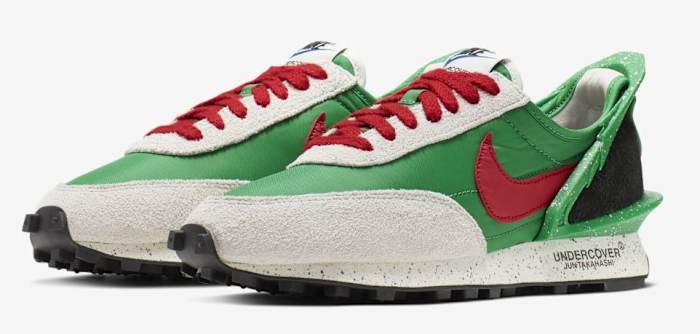 Side view of green, red, and black Nike sneakers.