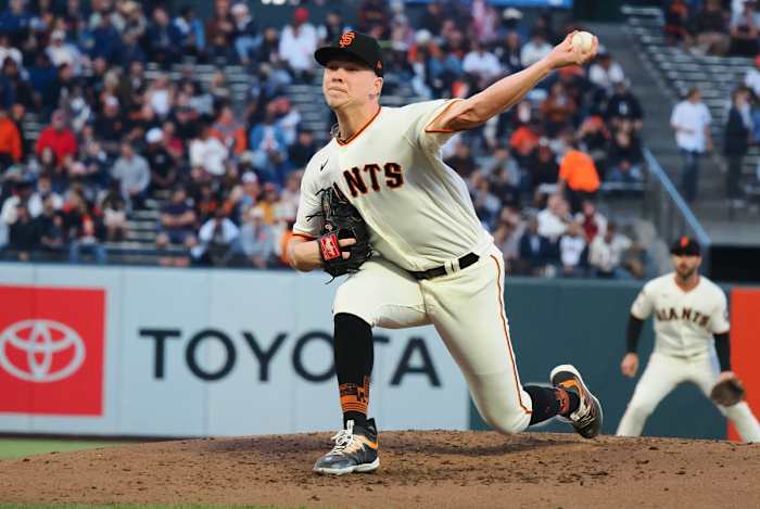 SF Giants starting pitcher Kyle Harrison throws a pitch against the Cincinnati Reds during the third inning at Oracle Park on August 28, 2023.