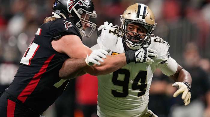 Jan 9, 2022; Atlanta, Georgia, USA; New Orleans Saints defensive end Cameron Jordan (94) tries to rush the passer blocked by Atlanta Falcons offensive tackle Kaleb McGary (76) during the second half at Mercedes-Benz Stadium. Mandatory Credit: Dale Zanine-USA TODAY Sports