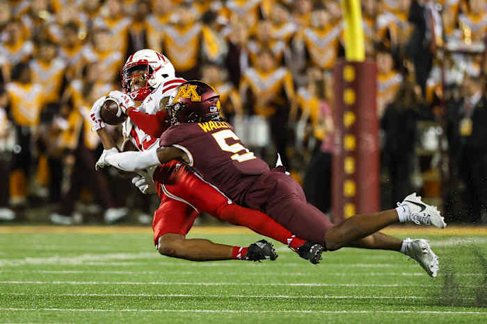 Nebraska Minnesota 2023 - Marcus Washington stopped by Minnesota defensive back Justin Walley