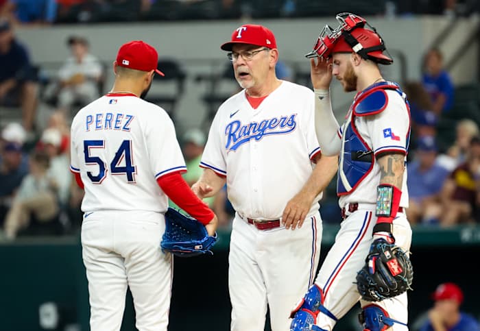 Sep 4, 2023; Arlington, Texas, USA; Texas Rangers manager Bruce Bochy (15) removes Texas Rangers starting pitcher Martin Perez (54) during the ninth inning against the Houston Astros at Globe Life Field. Mandatory Credit: Kevin Jairaj-USA TODAY Sports