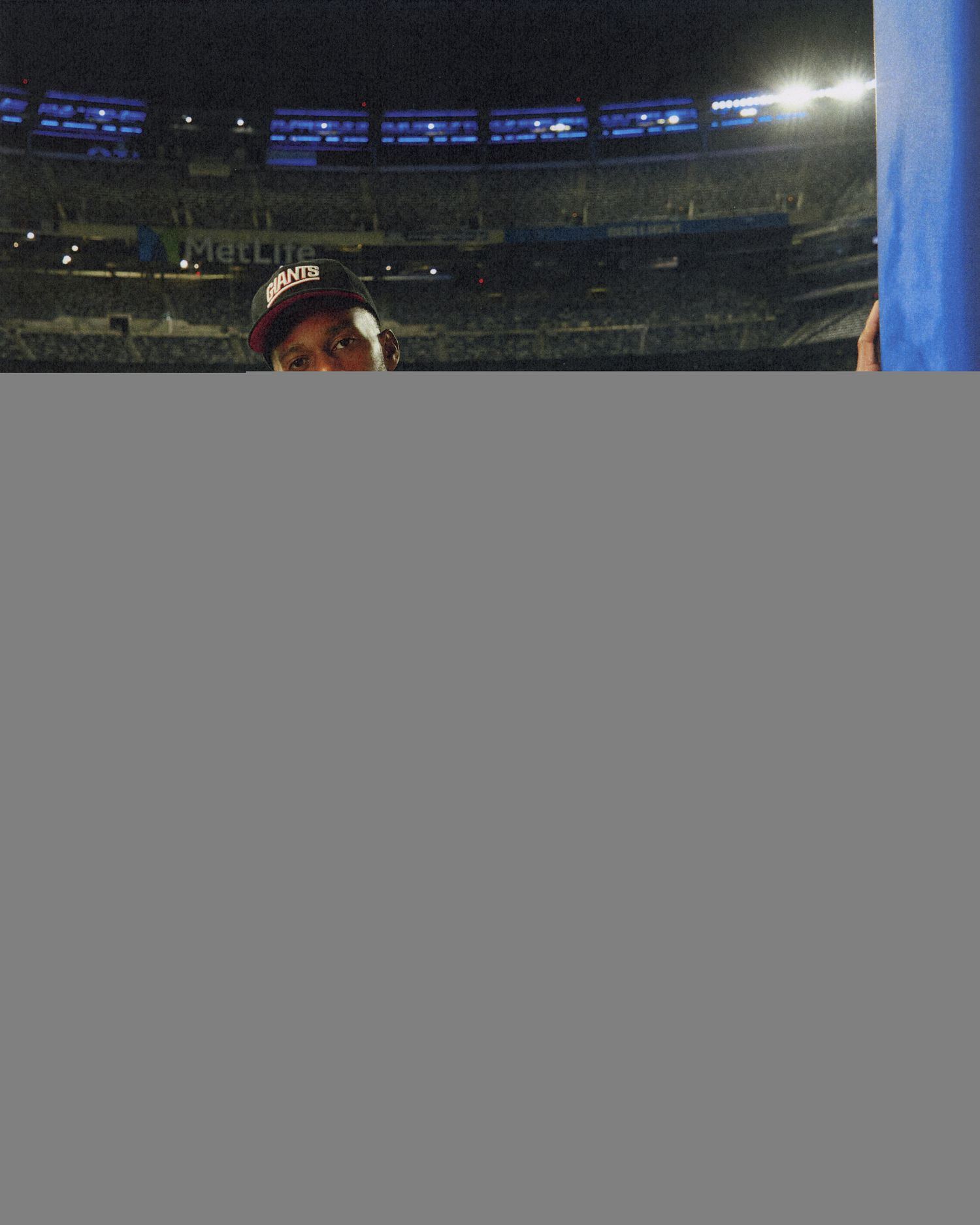 Victor Crus models New York Giants apparel.