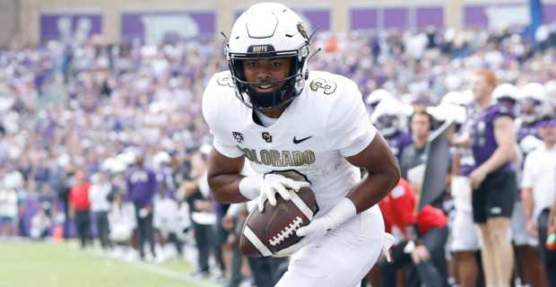 Colorado Buffaloes running back Dylan Edwards scores a touchdown during a college football game.