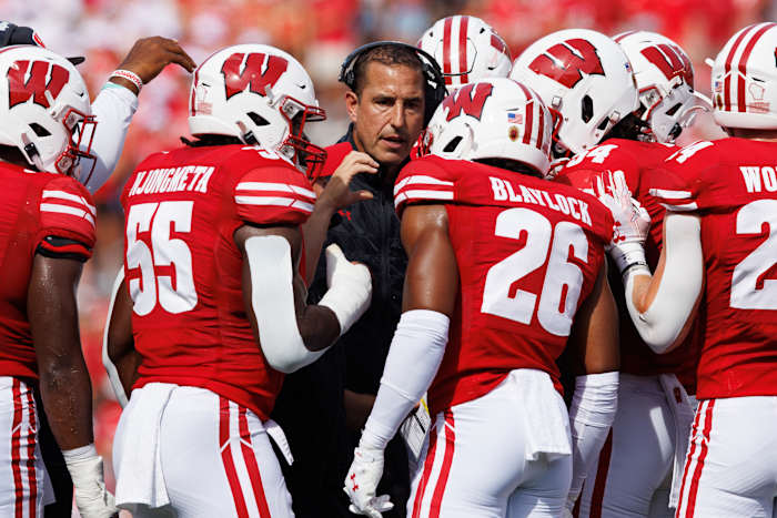 Sep 2, 2023; Madison, Wisconsin, USA; Wisconsin Badgers head coach Luke Fickell talks in a huddle during the second quarter against the Buffalo Bulls at Camp Randall Stadium. Mandatory Credit: Jeff Hanisch-USA TODAY Sports