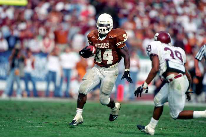 Texas Longhorns running back Ricky Williams runs against the Texas A&M Aggies.