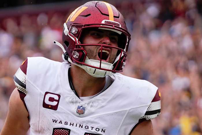 Sep 10, 2023; Landover, Maryland, USA; Washington Commanders quarterback Sam Howell (14) reacts after rushing for a touchdown against the Arizona Cardinals at FedExField. Mandatory Credit: Brent Skeen-USA TODAY Sports