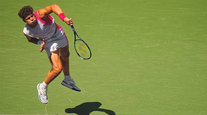 Ben Shelton serves at the U.S. Open.