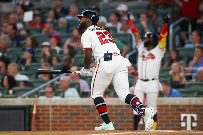 Aug 1, 2023; Atlanta, Georgia, USA; Atlanta Braves center fielder Michael Harris II (23) hits a home run as right fielder Ronald Acuna Jr. (13) looks on against the Los Angeles Angels in the fifth inning at Truist Park.