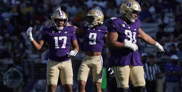 Freshman linebacker Deven Bryant (17) shares the field with cornerback Thaddeus Dixon and defensive tackle Tuli Letuligasenoa.