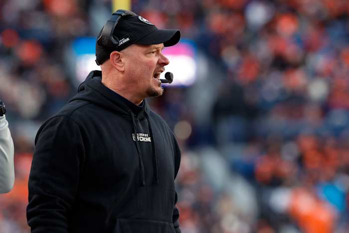 Nathaniel Hackett yells on the sideline wearing a headset