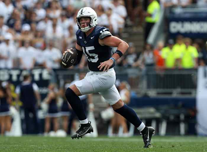 Penn State quarterback Drew Allar runs with the ball in the Nittany Lions' game against Delaware at Beaver Stadium.