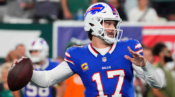 Josh Allen pulls his arm back to throw the ball