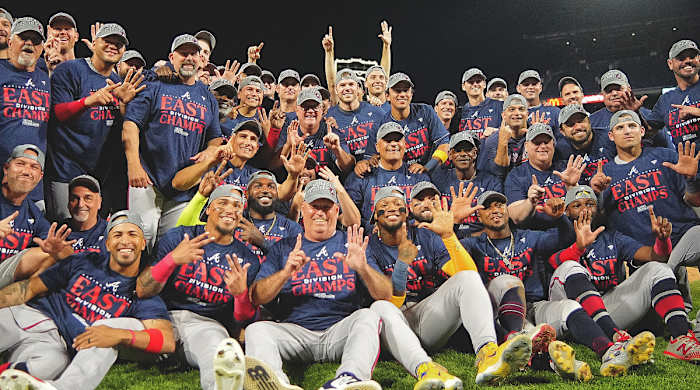 The Braves celebrate after winning the 2023 NL East title.