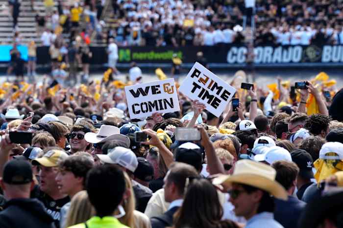 Colorado Buffaloes fans celebrate the win over the against the Nebraska Cornhuskers at Folsom Field