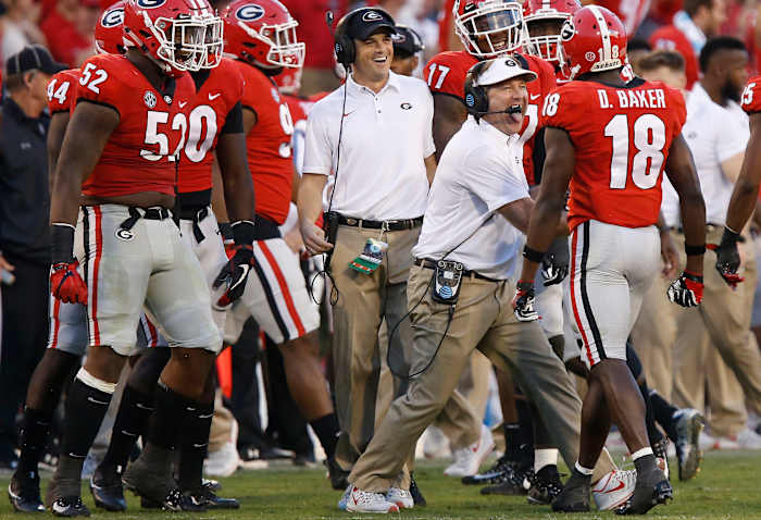 Georgia coach Kirby Smart celebrates with cornerback Deandre Baker (18) after a defensive stop in the second half against South Carolina during an NCAA college football game Saturday, Nov. 4, 2017, in Athens, Ga. (Joshua L. Jones/Athens Banner-Herald via AP)