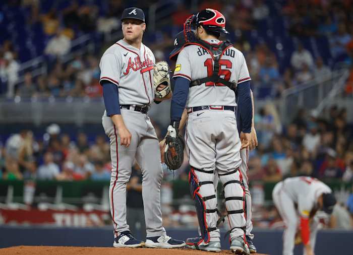 Sep 15, 2023; Miami, Florida, USA; Atlanta Braves starting pitcher Bryce Elder (55) and catcher Travis d'Arnaud (16) stand on the mound between batters against the Miami Marlins during the first inning at loanDepot Park.