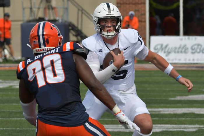 Penn State quarterback Drew Allar carries the ball against Illinois in a Big Ten Conference football game.