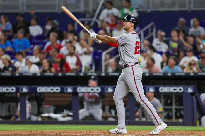 Sep 16, 2023; Miami, Florida, USA; Atlanta Braves first baseman Matt Olson (28) hits a home run against the Miami Marlins during the sixth inning at loanDepot Park.