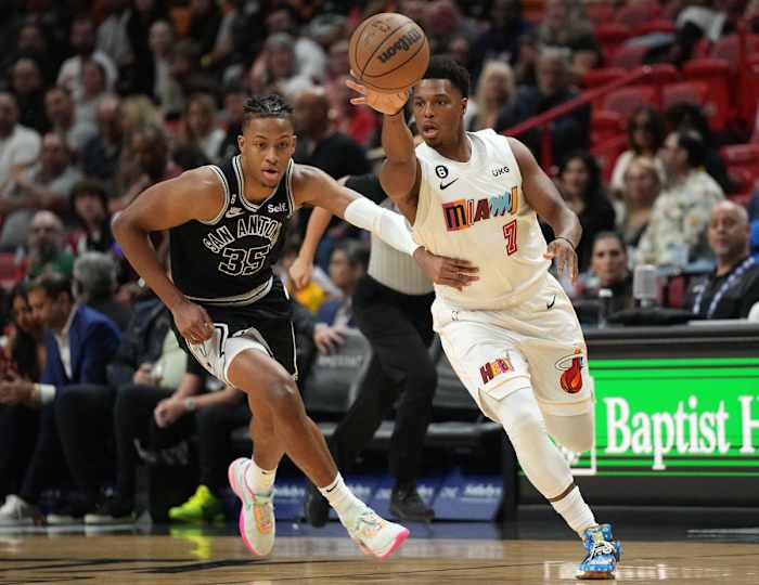 Miami Heat guard Kyle Lowry in a game against the San Antonio Spurs, guarded by Romeo Langford.