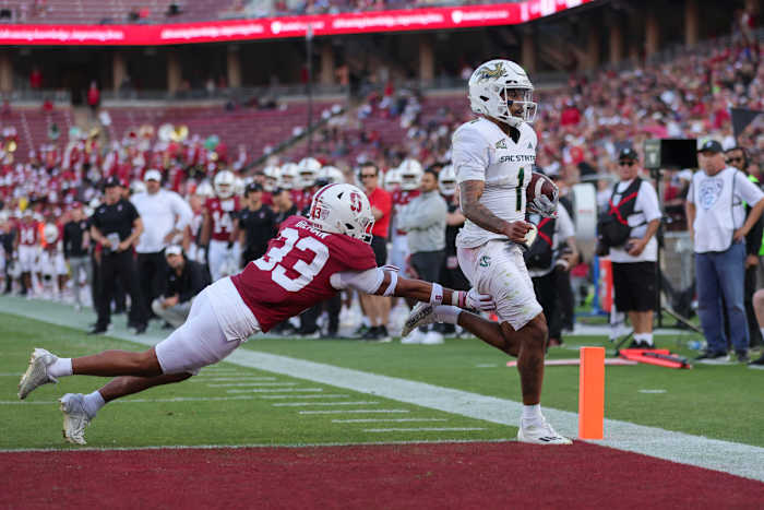 Sep 16, 2023; Stanford, California, USA; Sacramento State Hornets quarterback Kaiden Bennett (1) runs for a touchdown past Stanford Cardinal safety Alaka'i Gilman (33) during the second quarter at Stanford Stadium. Mandatory Credit: Sergio Estrada-USA TODAY Sports