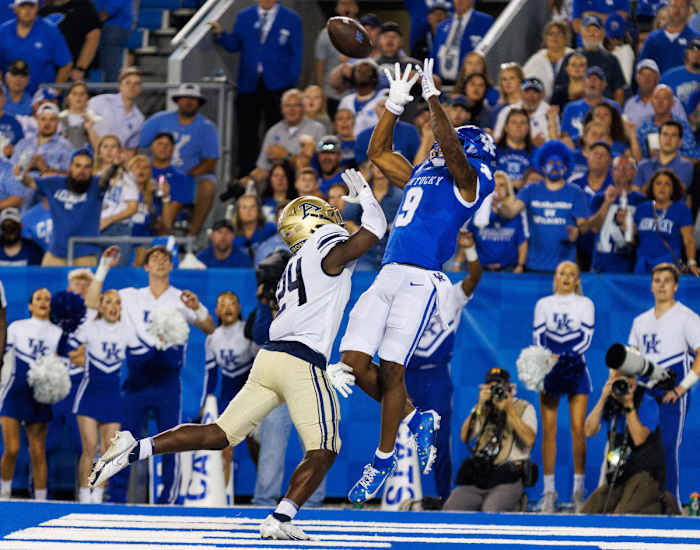 Sep 16, 2023; Lexington, Kentucky, USA; Kentucky Wildcats wide receiver Tayvion Robinson (9) catches a pass in the end zone for a touchdown during the second quarter against the Akron Zips at Kroger Field. Mandatory Credit: Jordan Prather-USA TODAY Sports