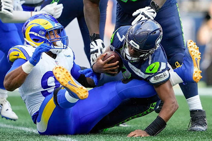Aaron Donald sacks Seattle Seahawks quarterback Geno Smith. Courtesy of Lindsey Wasson/AP Photo.