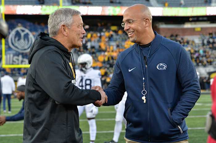 Iowa coach Kirk Ferentz (left) and Penn State coach James Franklin meet before the 2019 Penn State-Iowa game.