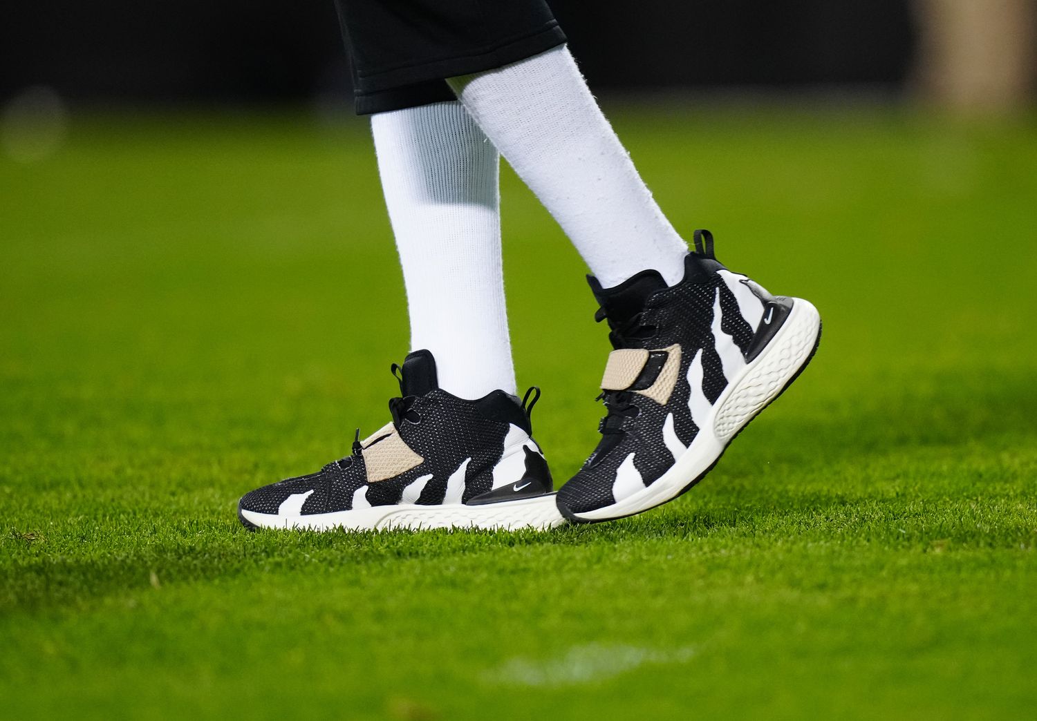 View of Deion Sanders' black and white Nike sneakers before a Colorado Buffaloes football game.