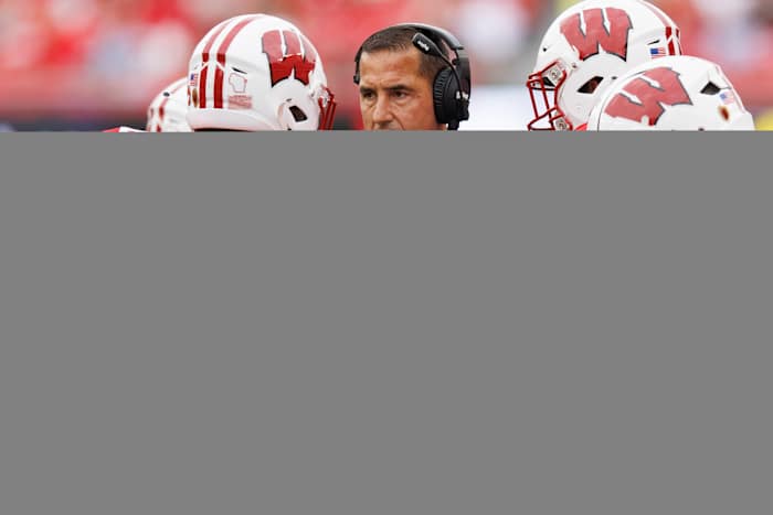 Sep 16, 2023; Madison, Wisconsin, USA; Wisconsin Badgers head coach Luke Fickell talks with linebacker Marty Strey (32) during the second quarter against the Georgia Southern Eagles at Camp Randall Stadium. Mandatory Credit: Jeff Hanisch-USA TODAY Sports