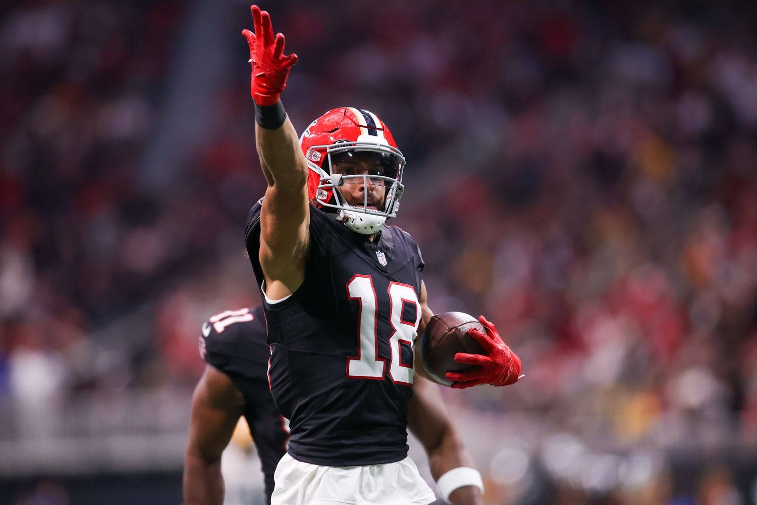 Atlanta Falcons wide receiver Mack Hollins (18) reacts after a catch against the Green Bay Packers in the second half at Mercedes-Benz Stadium.