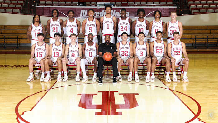 The 2023-24 Indiana men's basketball team pictured on Wednesday at Simon Skjodt Assembly Hall in Bloomington, Ind. Top row, from left: Jakai Newton (12), Mackenzie Mgbako (21), Anthony Walker (4), Malik Reneau (5), Kel'el Ware (1), Payton Sparks (24), Kaleb Banks (10), CJ Gunn (11), Ian Stephens (30). Bottom row, from left: James Goodis (15), Shaan Burke (13), Gabe Cupps (2), Xavier Johnson (0), head coach Mike Woodson, Trey Galloway (32), Anthony Leal (3), Jordan Rayford (53), Jackson Creel (22).