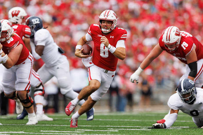 Sep 16, 2023; Madison, Wisconsin, USA; Wisconsin Badgers quarterback Tanner Mordecai (8) rushes with the football during the third quarter against the Georgia Southern Eagles at Camp Randall Stadium. Mandatory Credit: Jeff Hanisch-USA TODAY Sports