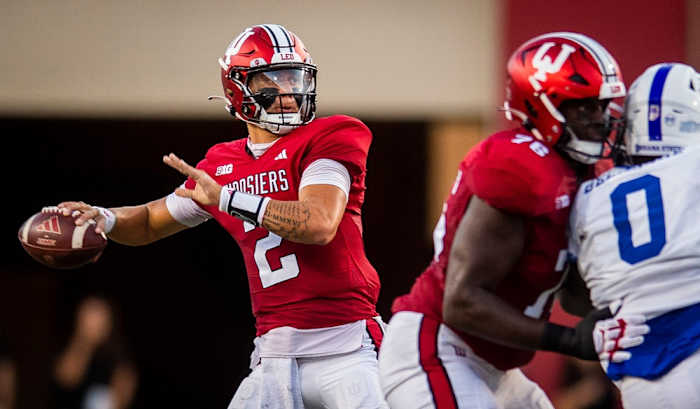 Indiana offensive lineman Matthew Bedford protects quarterback Tayven Jackson as he winds up to pass against Indiana State.